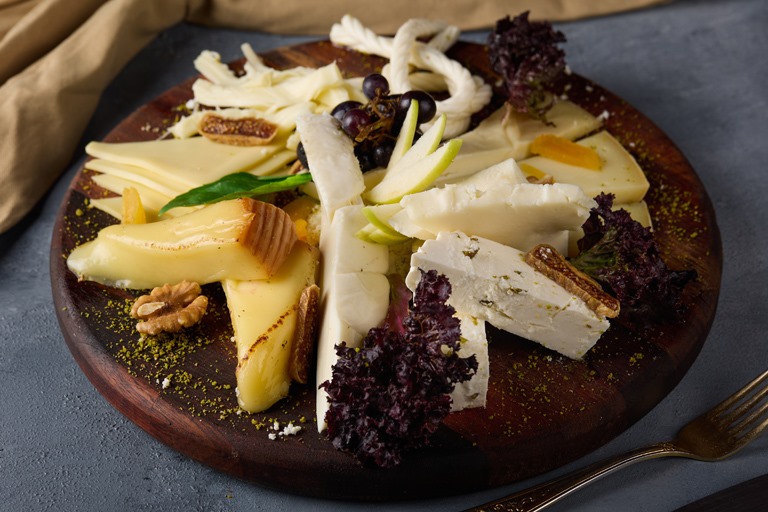 Ruvia Restaurant - peynir tabagi, a Turkish cheese platter with aged and fresh white cheeses, walnuts and greens