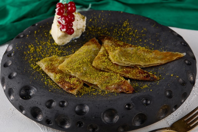 Ruvia Restaurant - katmer, thin layered pastry with clotted cream and crushed pistachio served hot